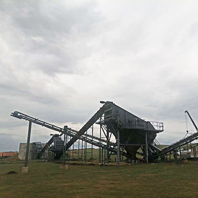 Crushing Line On-Site View displays the live, integrated operation of crushing, screening, and conveying machinery converting raw rocks into processed aggregates in an active mining or quarry environment.